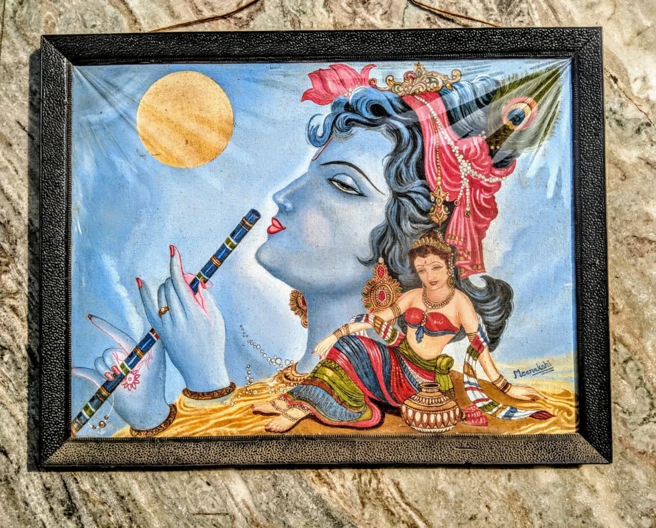 Stylised Radha-Krishna profile beneath a moon in cool blue and gold