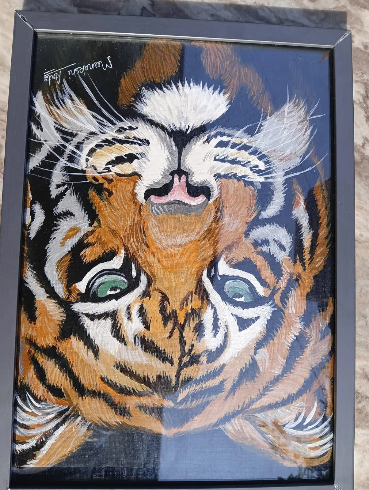 Close-up tiger face with striking green eyes